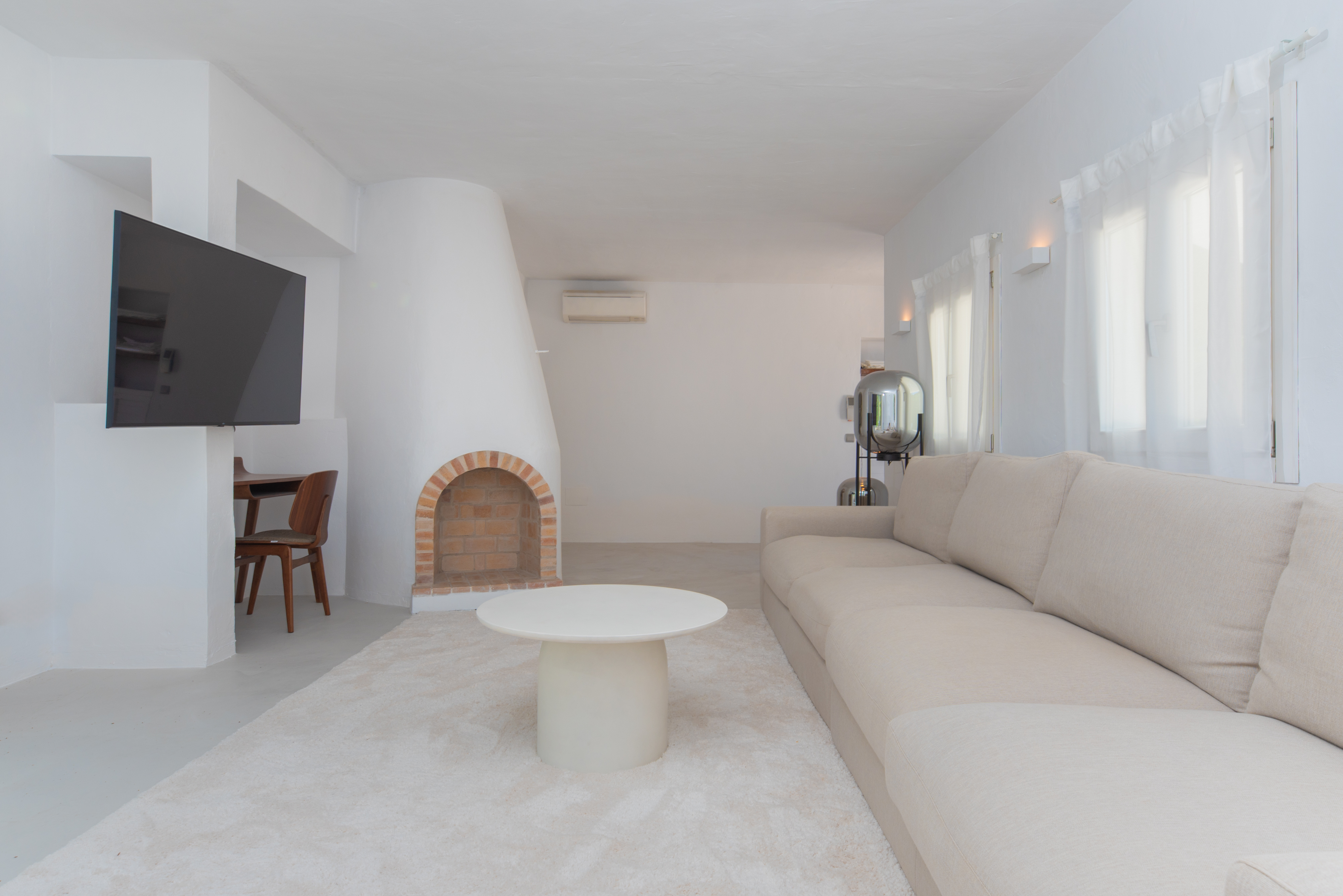 Living area with fireplace alcove — authentic finca character